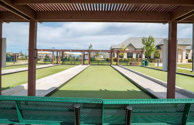 7594 Trull Brook Lane, Frisco, TX 75036 Westside bocce ball courts featuring artificial turf and concrete borders