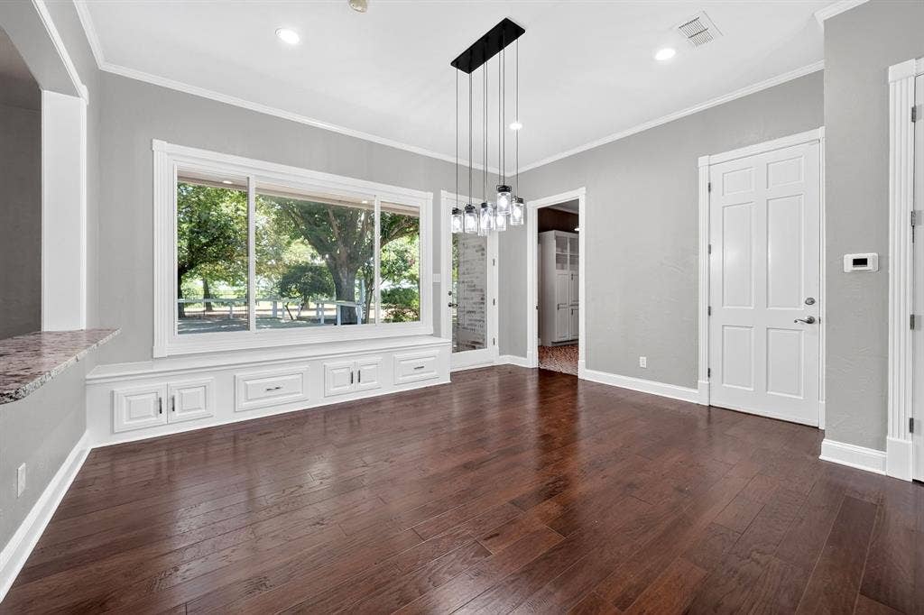 1201 Robbins Road, Athens, TX 75751 Breakfast Nook with built in window seating. View of Laundry Room & Garage Entrance.