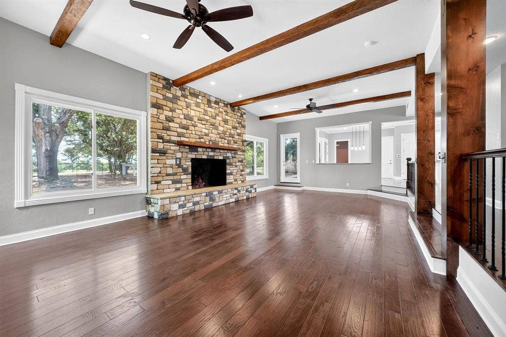 1201 Robbins Road, Athens, TX 75751 Spacious Living Room Area featuring Stone Woodburning Fireplace