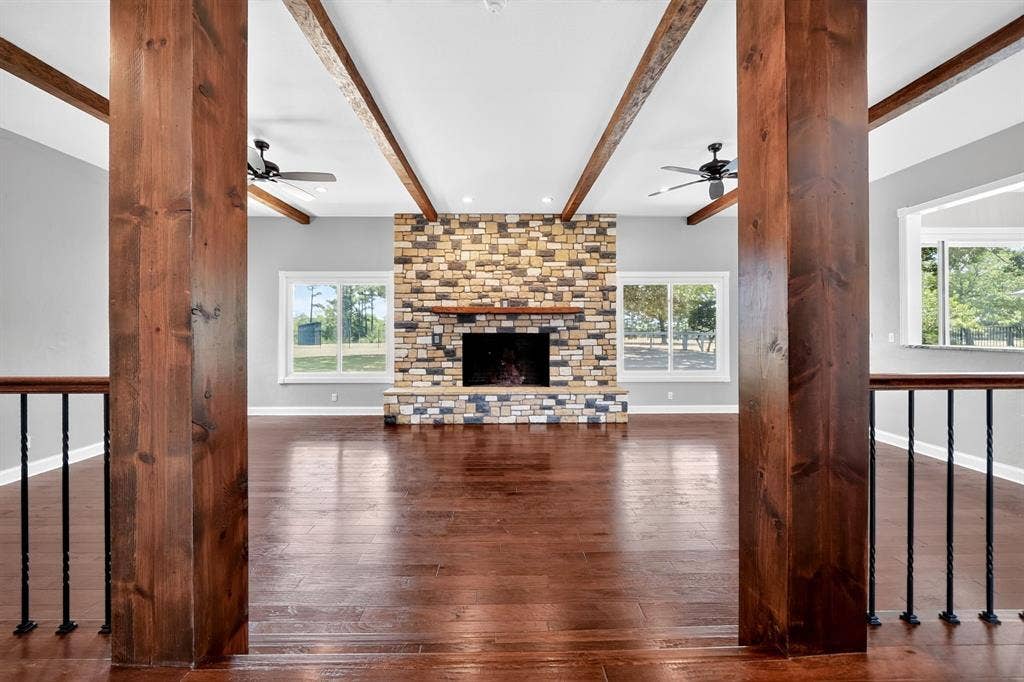 1201 Robbins Road, Athens, TX 75751 Spacious Living Room Area featuring Stone Woodburning Fireplace
