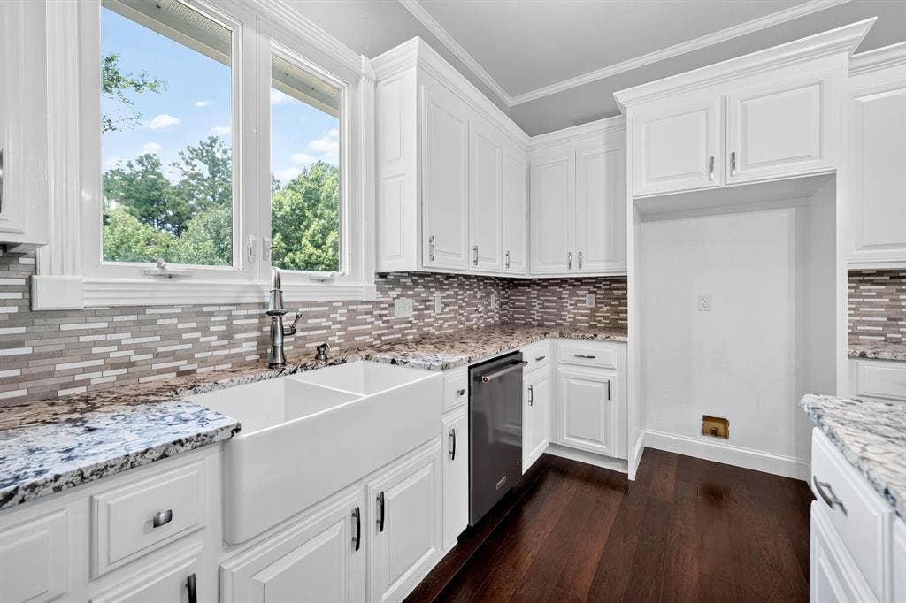 1201 Robbins Road, Athens, TX 75751 Kitchen featuring white cabinetry, a large farmhouse-style sink, granite countertops, a mosaic tile backsplash, and dark wood-finish flooring