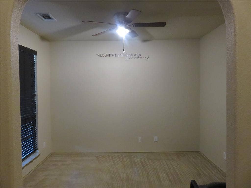 1122 Walter Stephenson Road, Midlothian, TX 76065 Spacious room featuring neutral-toned walls and wood-finish flooring