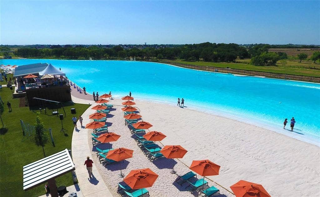 3861 Dalea Drive, Prosper, TX 75078 Expansive man-made lagoon with a sandy beach and clear blue water