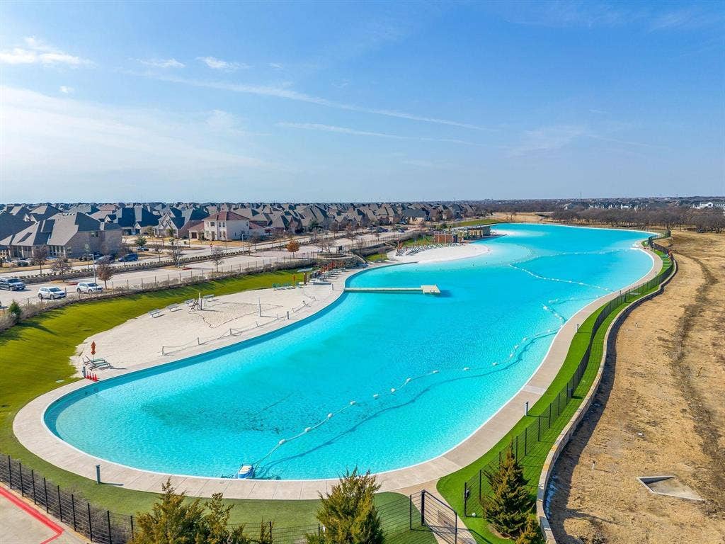 3861 Dalea Drive, Prosper, TX 75078 Windsong Ranch Lagoon - Expansive blue lagoon with surrounding sandy beaches