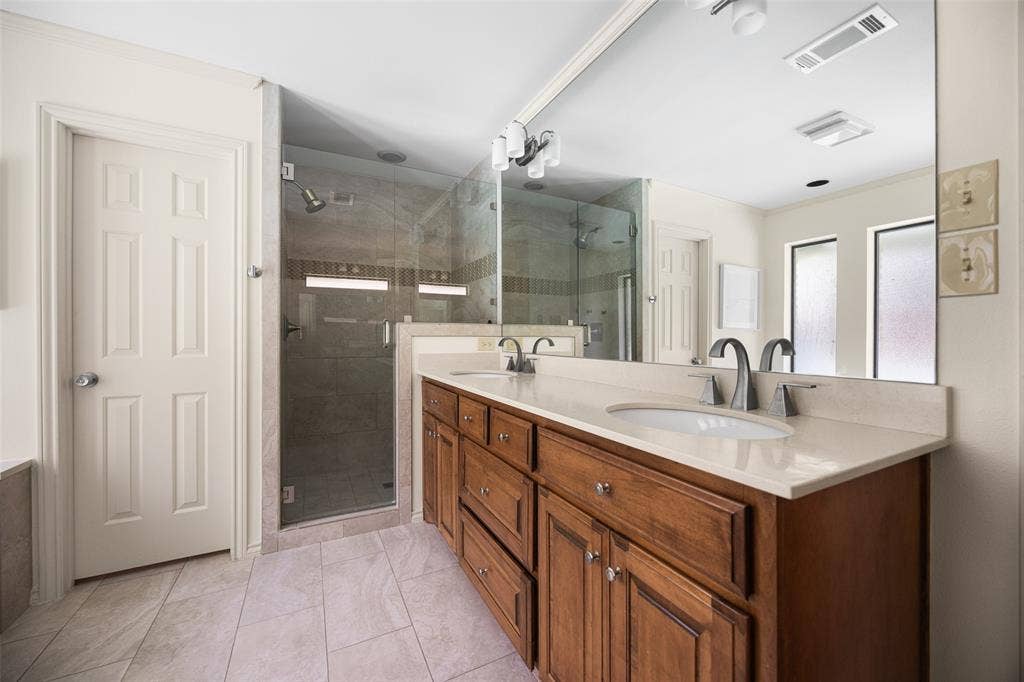 6501 Copper Creek Drive, Dallas, TX 75248 Dual vanity with integrated sinks and brushed nickel fixtures