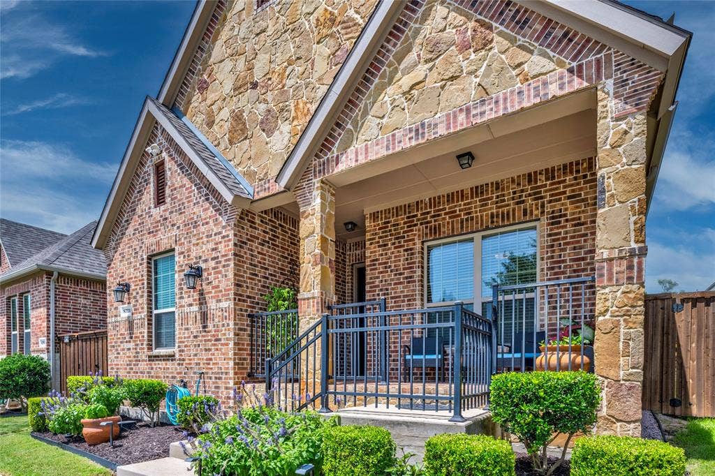 8721 Ludlow Drive, Frisco, TX 75036 Decorative metal porch railing for added appeal.