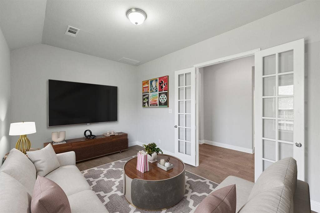 Spacious entertainment room along corridor, virtually staged. Could be used as a study, playroom, media room, whatever your heart desires!
