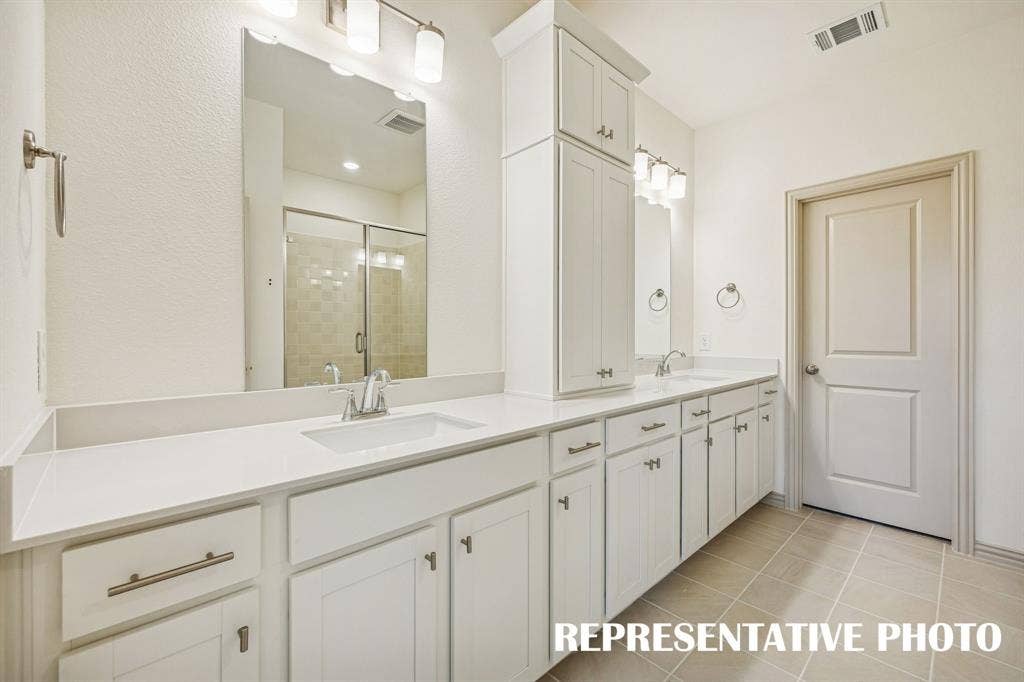 3563 Pierce Lane, Grand Prairie, TX 75052 Featuring ample storage and vanity space, this owner's bath was designed with two in mind! REPRESENTATIVE PHOTO
