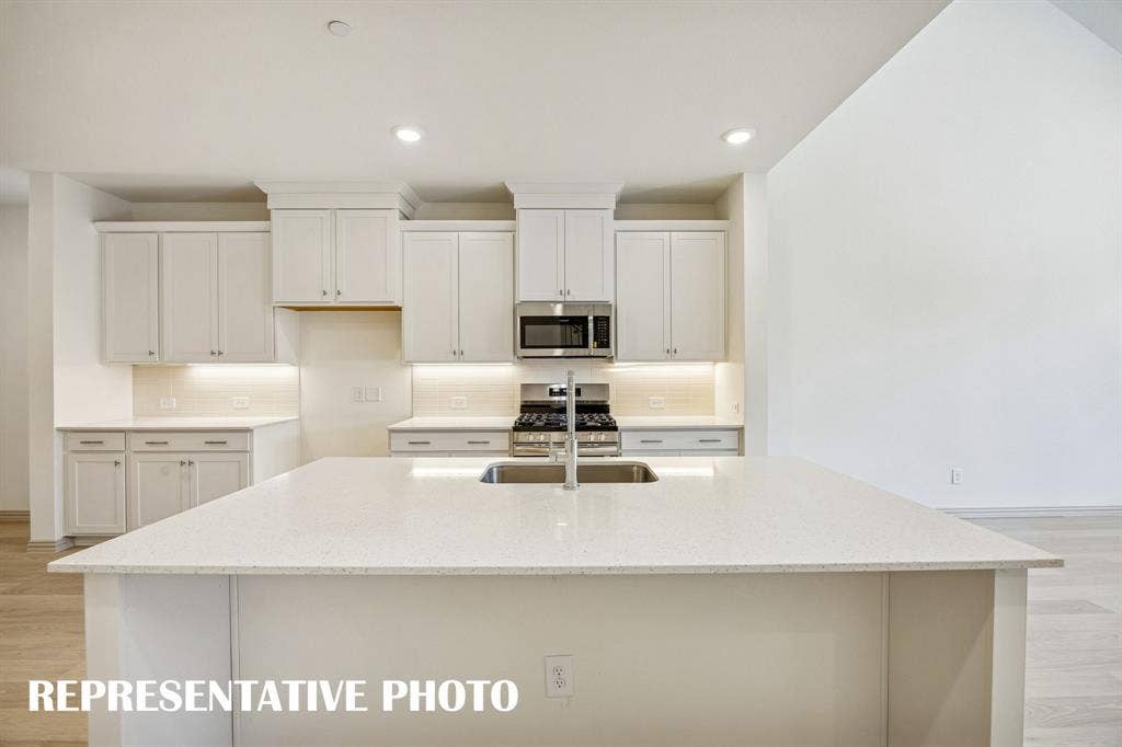 3563 Pierce Lane, Grand Prairie, TX 75052 Your spacious kitchen island is the perfect place for friends and family to gather round! REPRESENTATIVE PHOTO