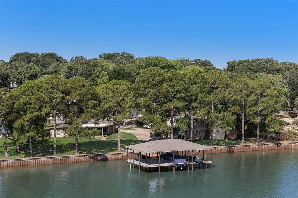 Private boat dock with covered slips and direct water access