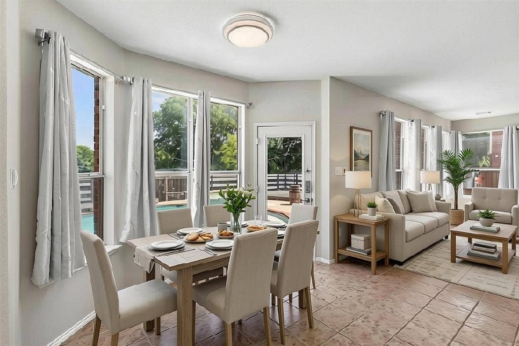 1013 Larkspur Drive, Allen, TX 75002 Open-concept dining and living areas bathed in natural light through multiple glass doors and windows with transom details
