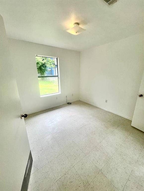 506 W Green Avenue, Killeen, TX 76541 Spare room with light flooring and baseboards