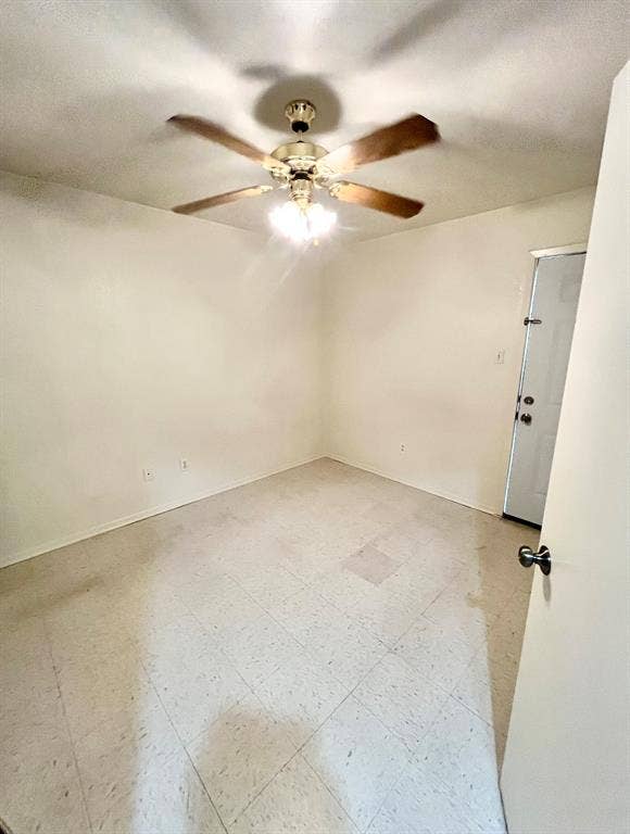 506 W Green Avenue, Killeen, TX 76541 Unfurnished room with light floors and a textured ceiling