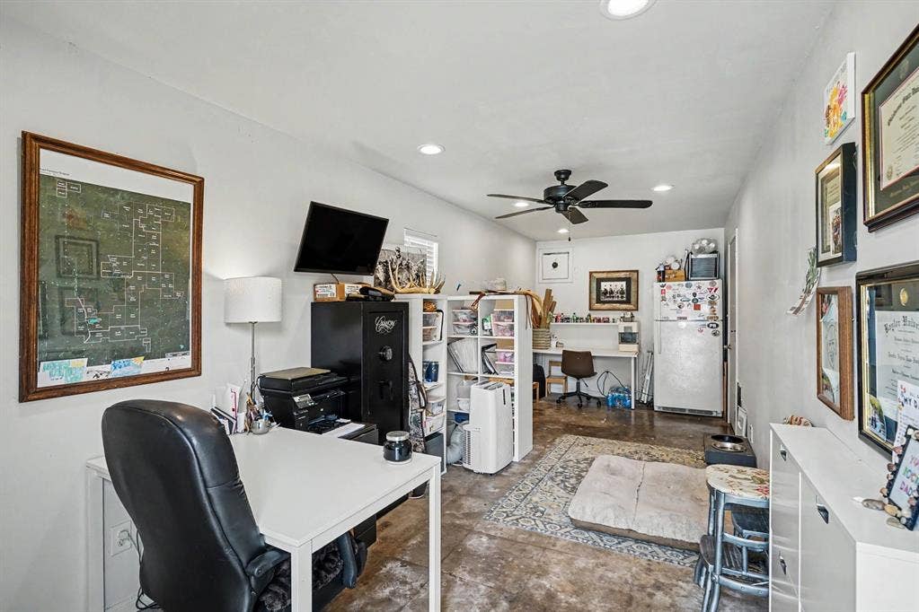 708 Summer Place, Murphy, TX 75094 Office space attached to the 3 car garage. Concrete floors, exhaust fan for commercial grade oven or workshop.