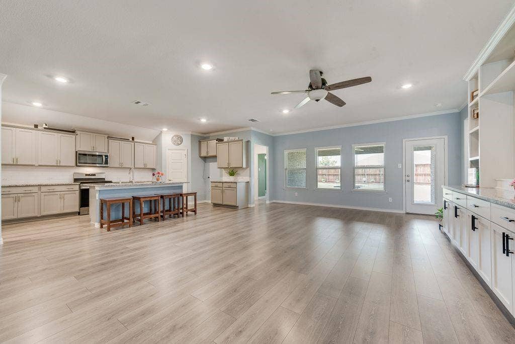 Living Room and Kitchen views.  Extras throughout this thoughtfully upgraded home.  Built-ins you won't find in this foorplan have been included.