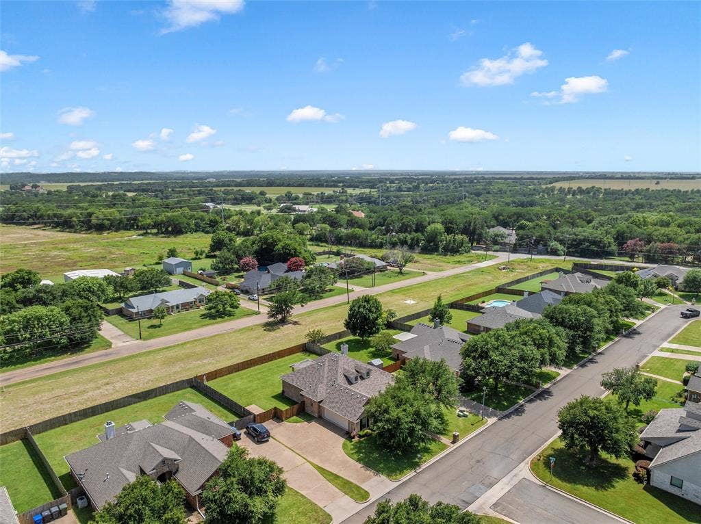 Residential neighborhood featuring paved streets and established homes on individual lots