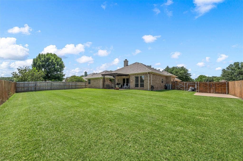 Expansive green lawn providing abundant outdoor space