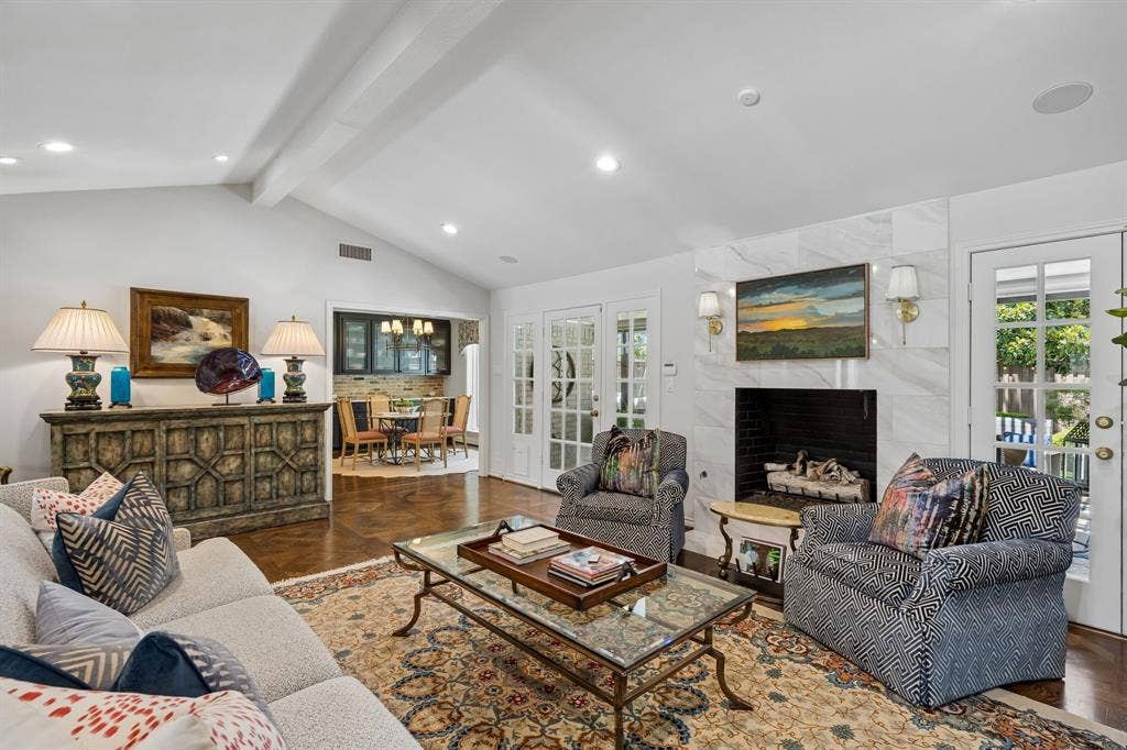 6829 Midcrest Drive, Dallas, TX 75254 Family Room with two sets of French Doors to Back yard and pool area. Open to Breakfast Room and Kitchen.