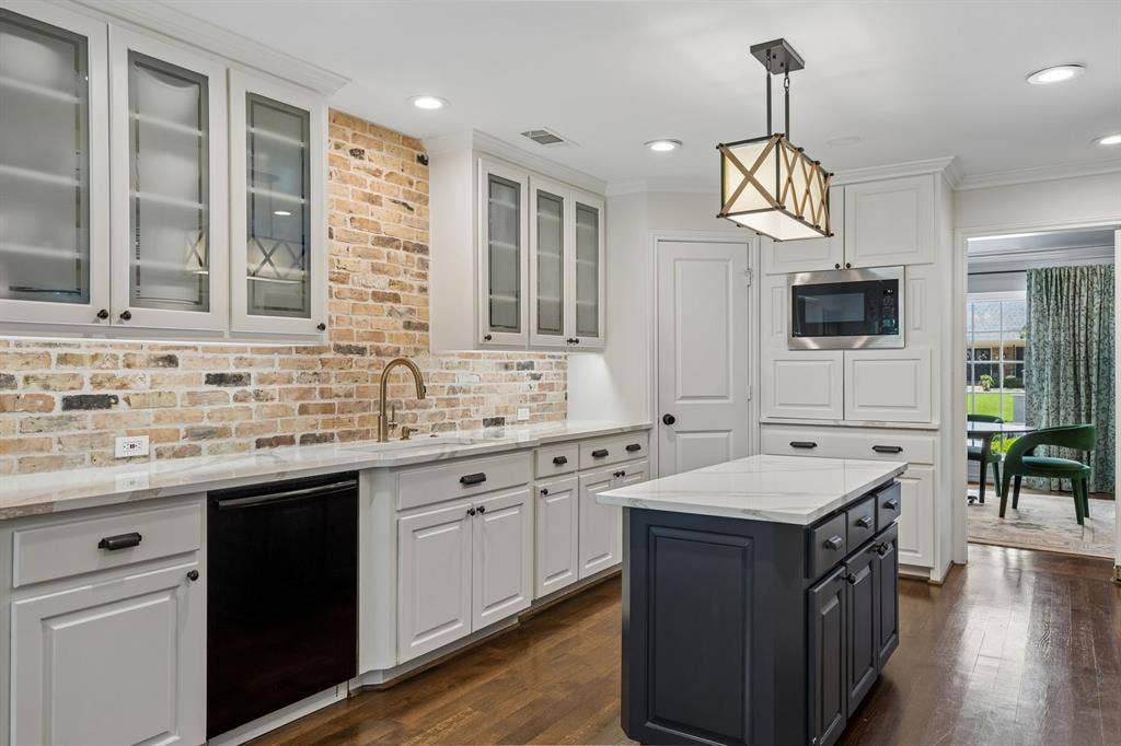 6829 Midcrest Drive, Dallas, TX 75254 Kitchen with Farm Sink, Built in Microwave and Appliance Cabinet.