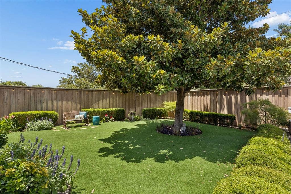 6829 Midcrest Drive, Dallas, TX 75254 Yard with Turf grass for easy maintenance.