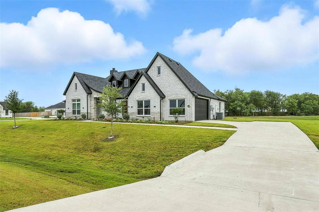 3141 Claire Drive, Midlothian, TX 76065 Modern farmhouse architecture featuring light-colored brick, a dark shingle roof, and multiple gables