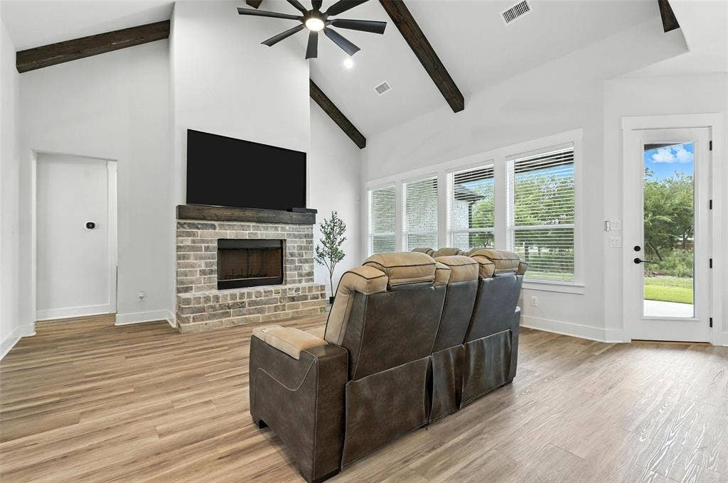 3141 Claire Drive, Midlothian, TX 76065 Contemporary brick exterior with dark trim accents, a prominent front gable, a multi-pane wood-finish entry door, and a spacious green lawn