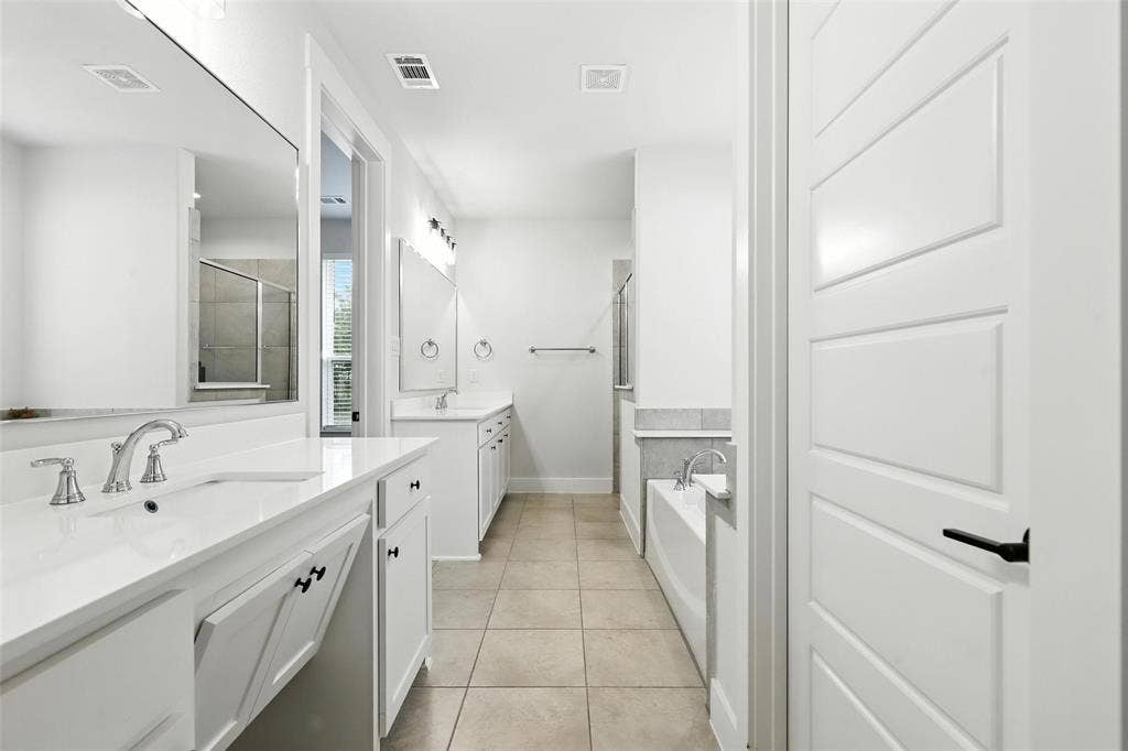 3141 Claire Drive, Midlothian, TX 76065 Bright bathroom featuring dual vanities with white countertops and chrome fixtures