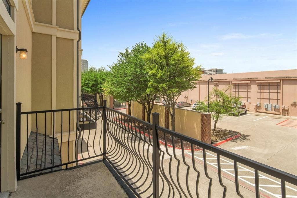 5717 PANTHEON Court, Plano, TX 75024 Private balcony featuring a concrete floor and decorative black wrought iron railing