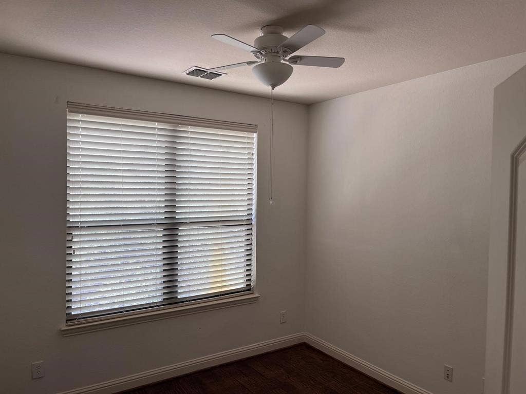 5717 PANTHEON Court, Plano, TX 75024 Spacious room featuring a window with white horizontal blinds, a ceiling fan, crown molding, and wood-finish flooring