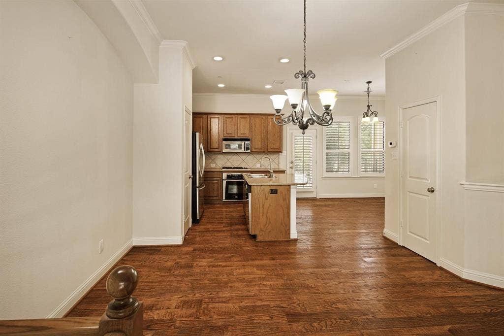 5717 PANTHEON Court, Plano, TX 75024 Open-concept living space with wood-finish flooring throughout