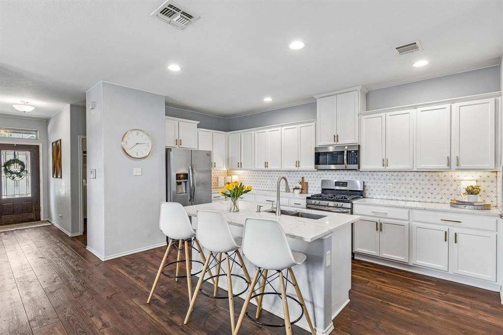 3500 Brazos Street, Melissa, TX 75454 updated kitchen with marble backsplash and upgraded countertops and hardware