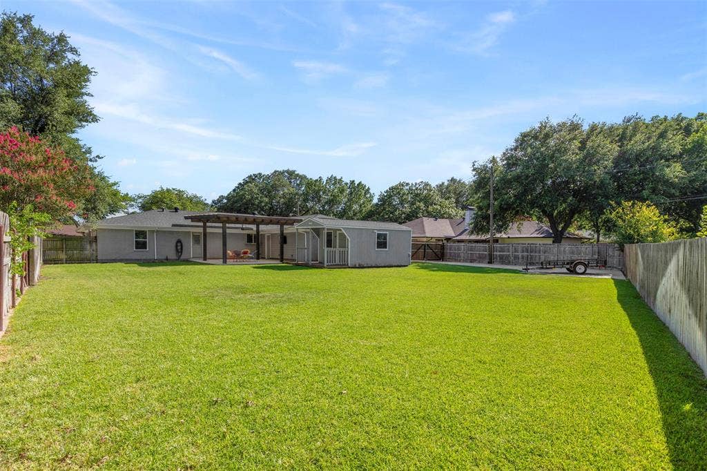 1801 Alexander Drive, Waxahachie, TX 75165 Beautiful backyard (about .4 acre) with extended parking for RV parking; storage shed and covered patio. Property backs up to Crawford Park.