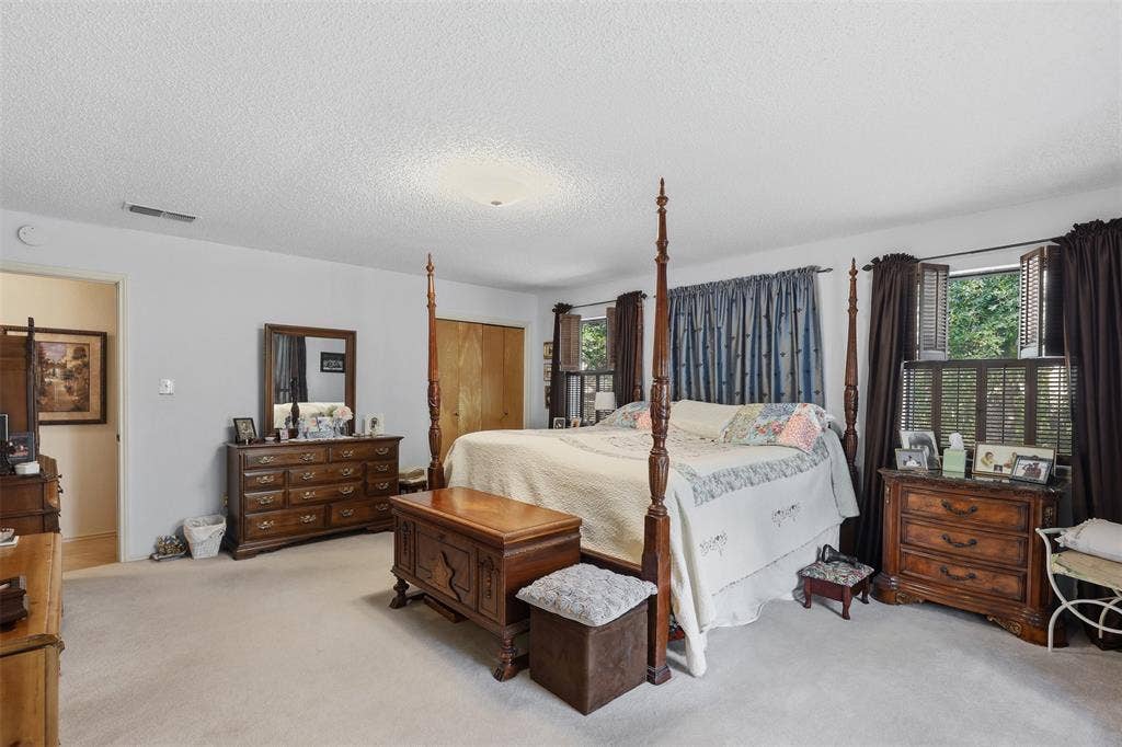 777 Wildwood Trail, Weatherford, TX 76085 Spacious bedroom featuring light-toned carpeting and neutral wall tones