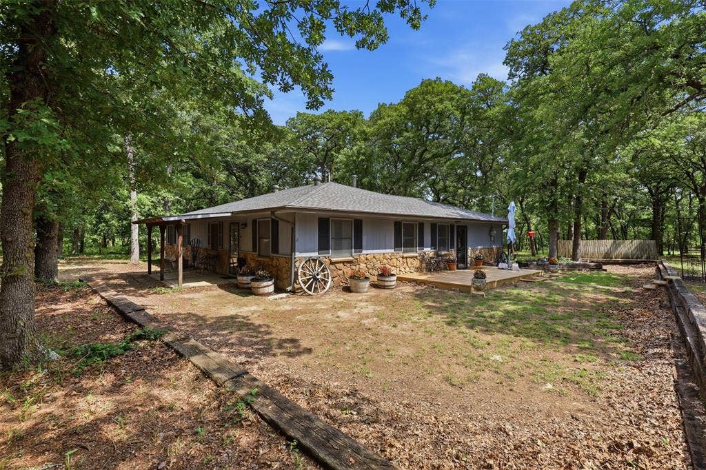 777 Wildwood Trail, Weatherford, TX 76085 Country charmer tucked in the trees!