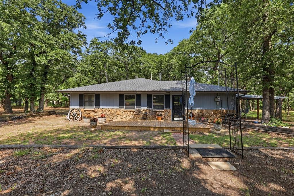 777 Wildwood Trail, Weatherford, TX 76085 Ranch-style residence featuring a stone and siding exterior