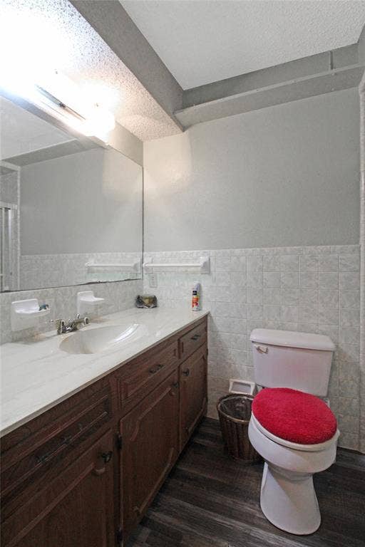 8769 S Fm 148, Scurry, TX 75158 Bathroom featuring a wood-finish vanity with an integrated sink and light-colored countertop