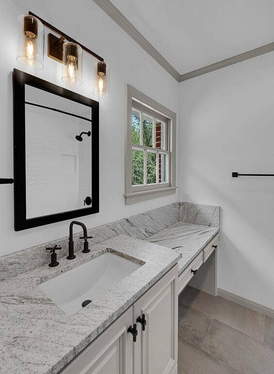 2825 Lake Air Drive, Waco, TX 76710 Expansive vanity featuring a built-in rectangular sink, light granite countertop, and matte black faucet