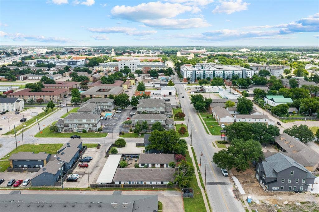 1405 Speight Avenue, #1, Waco, TX 76706 Aerial perspective showcasing a mixed-use neighborhood with diverse architectural styles, including multi-story residential buildings and commercial properties