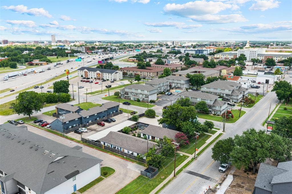 1405 Speight Avenue, #1, Waco, TX 76706 Aerial perspective showcasing a collection of multi-family buildings with ample surface parking