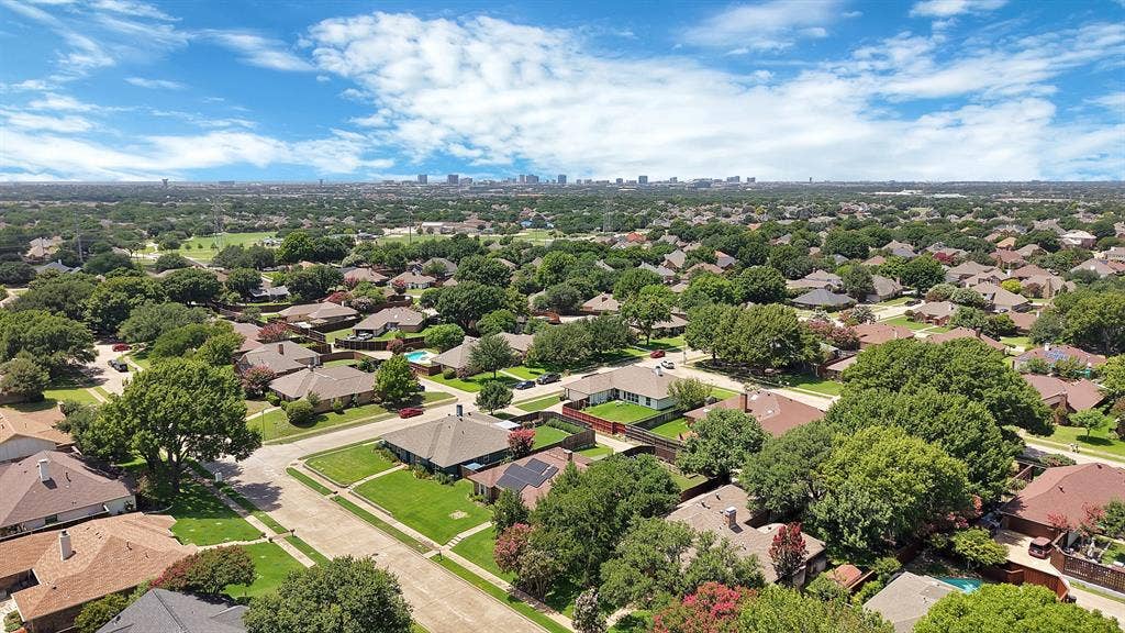 4021 San Mateo Drive, Plano, TX 75093 Expansive residential area featuring numerous detached homes with varied rooflines and mature tree coverage