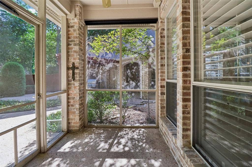 2600 Saratoga, McKinney, TX 75070 Screened porch with brick accents, exposed aggregate flooring, and multiple windows