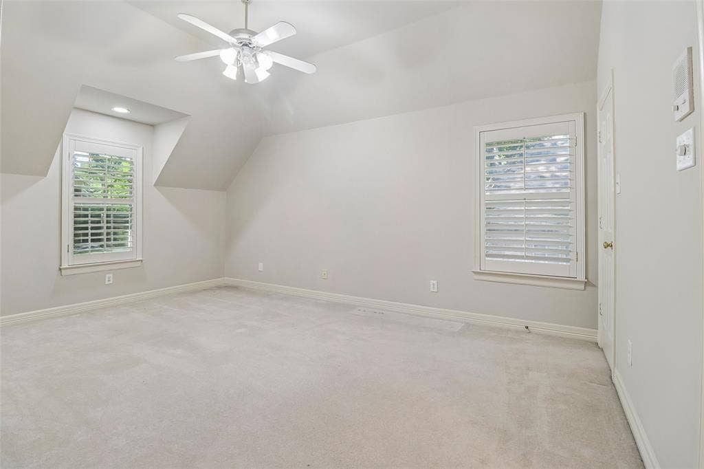 2600 Saratoga, McKinney, TX 75070 Light-toned carpeting, two windows with plantation shutters, ceiling fan, and recessed lighting