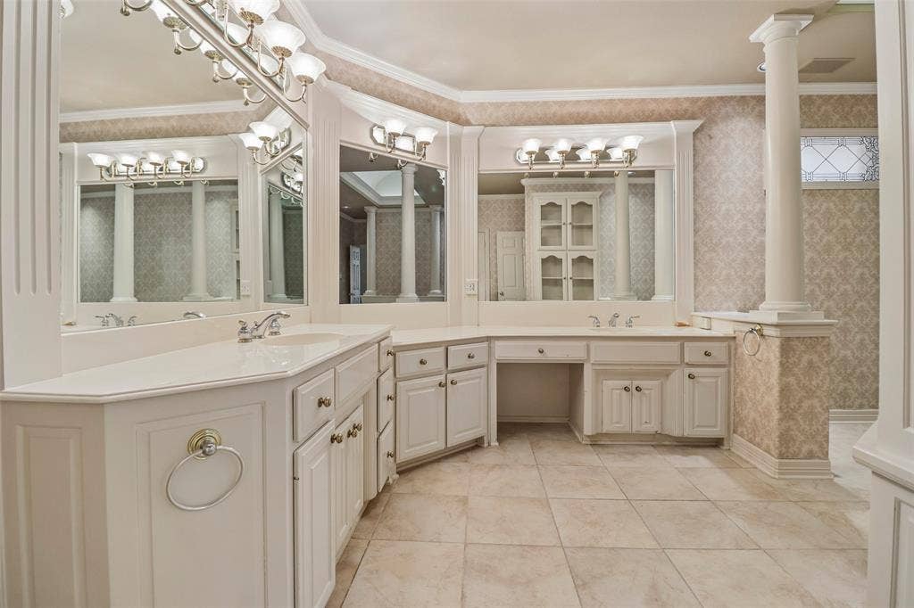 2600 Saratoga, McKinney, TX 75070 Dual vanity with integrated sinks, white cabinetry, and brushed nickel hardware