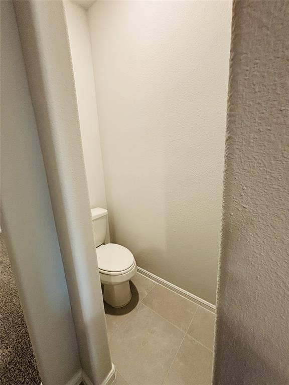 912 Santa Lucia Drive, Anna, TX 75409 Bathroom with toilet and tile patterned flooring