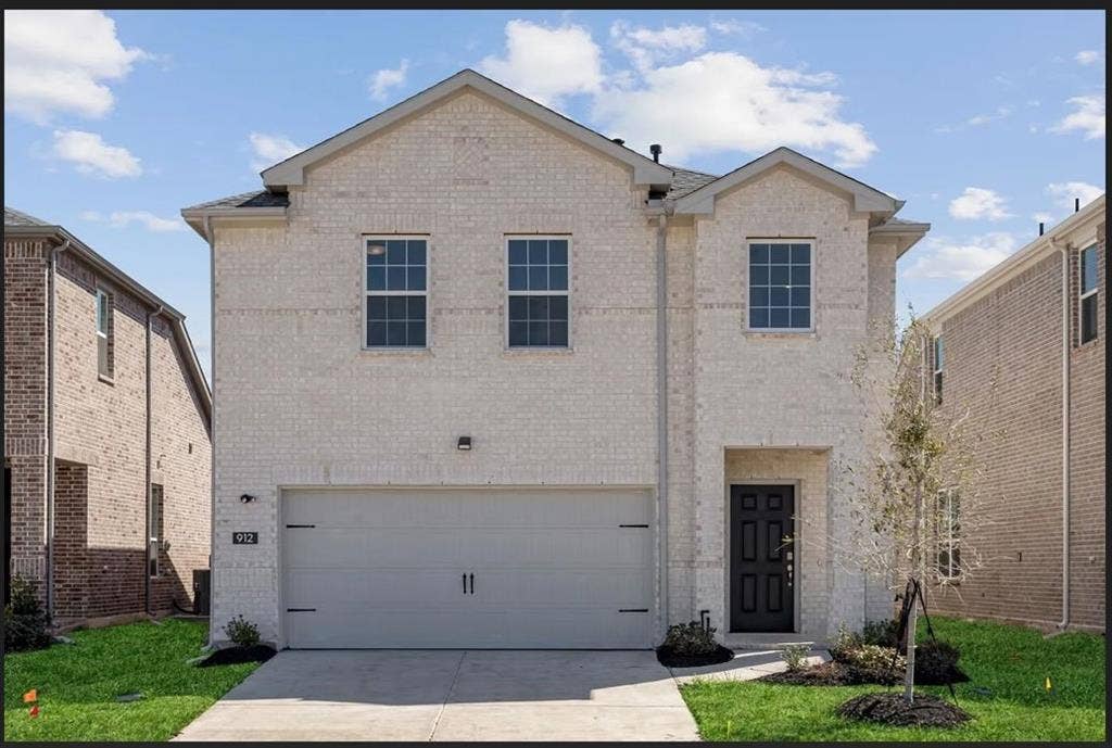912 Santa Lucia Drive, Anna, TX 75409 View of front of home with brick siding, concrete driveway, and a garage
