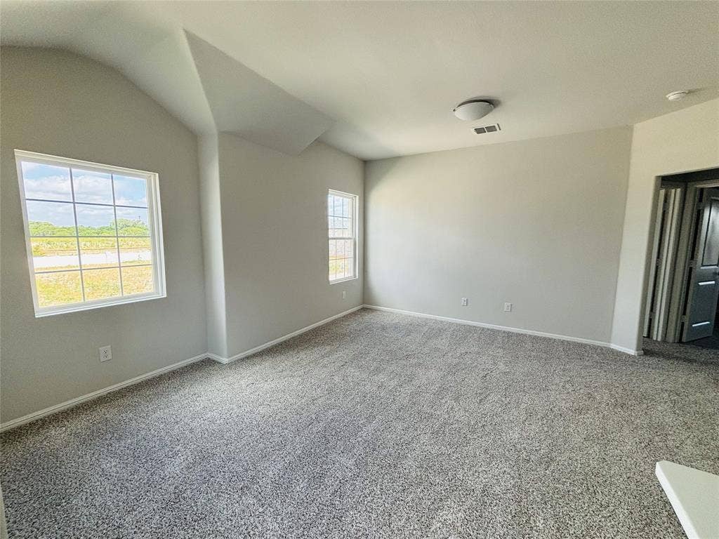 912 Santa Lucia Drive, Anna, TX 75409 Carpeted empty room featuring a smoke detector and vaulted ceiling