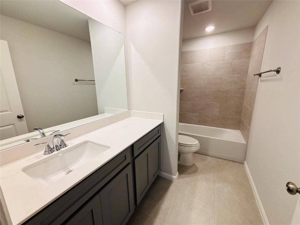 912 Santa Lucia Drive, Anna, TX 75409 Full bath with vanity, tile patterned flooring, and tub / shower combination