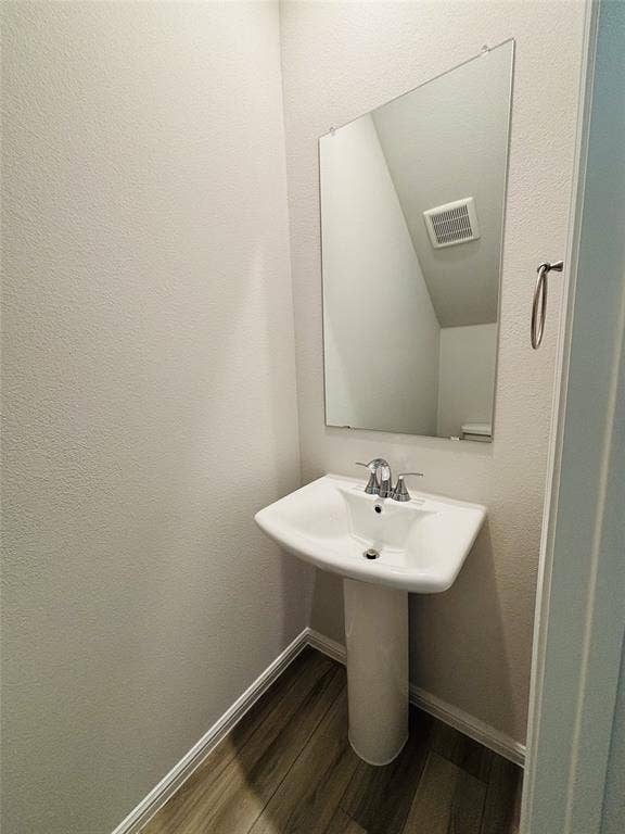 912 Santa Lucia Drive, Anna, TX 75409 Bathroom featuring wood finished floors and baseboards