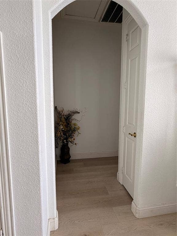 2301 Clearspring Drive S, Irving, TX 75063 Archway entryway with wood-finish flooring