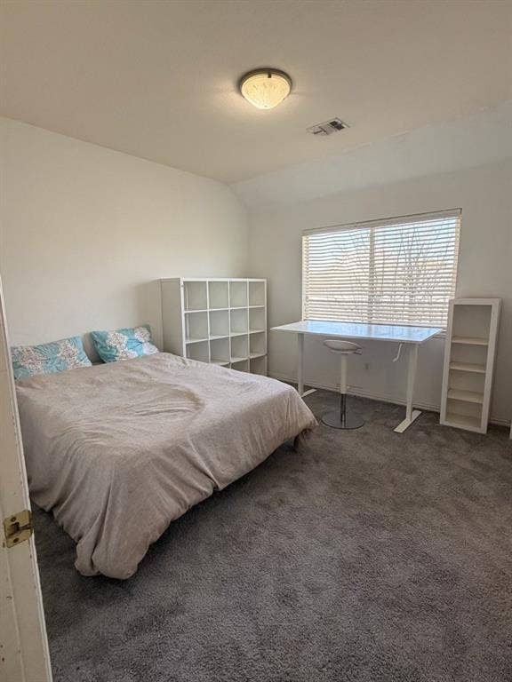 2301 Clearspring Drive S, Irving, TX 75063 Carpeted bedroom #3 with a large window, featuring a ceiling-mounted light fixture and white walls